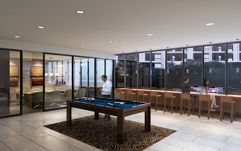 Large well lit game room with billiards table 